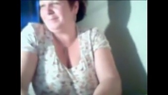 Older Woman Flaunts Her Breasts On Camera